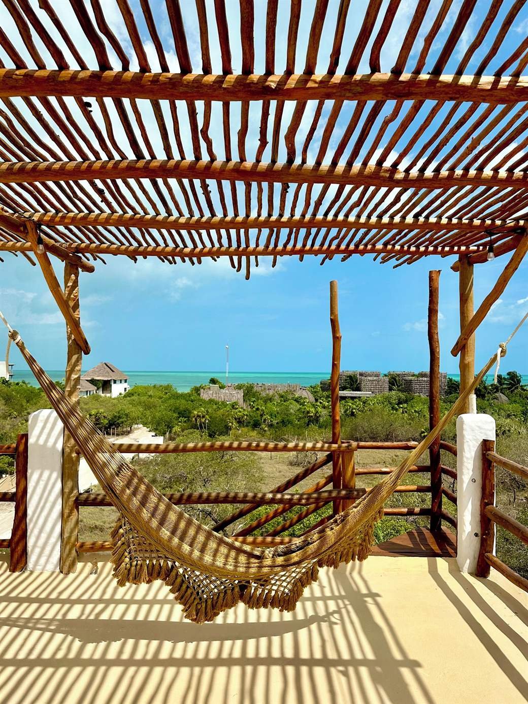 La Casa del Sol Holbox: hammock under the rooftop pergola, with a view over the island